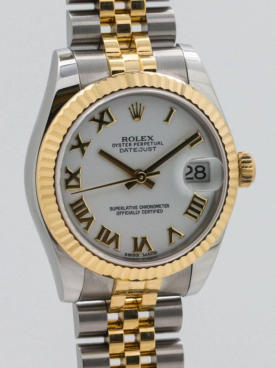 Rolex Stainless Steel and 18K Yellow Gold Midsize Datejust ref 178273;  serial #U0 circa 2015. New style robust case model, 31mm diameter case with 18K yellow gold fluted bezel and sapphire crystal. Original white enamel dial with applied gold Roman