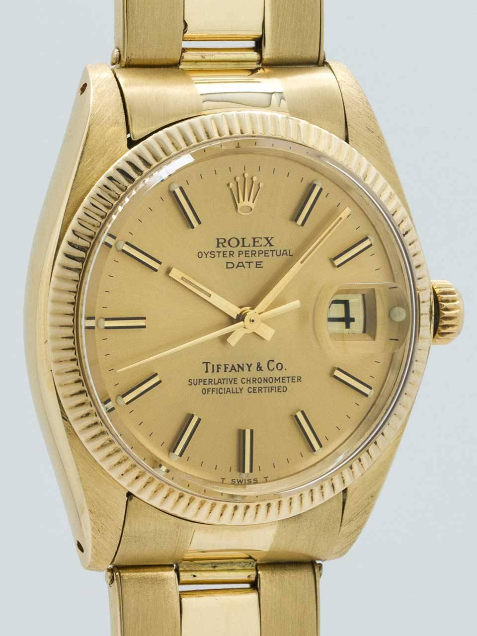 Rolex 14K Yellow Gold Oyster Perpetual Date ref 1500 circa 1979 retailed by Tiffany & Co. Classic vintage man’s model, also ideal oversize for a woman. 34mm diameter case with fluted bezel and acrylic crystal. With original mint condition champagne