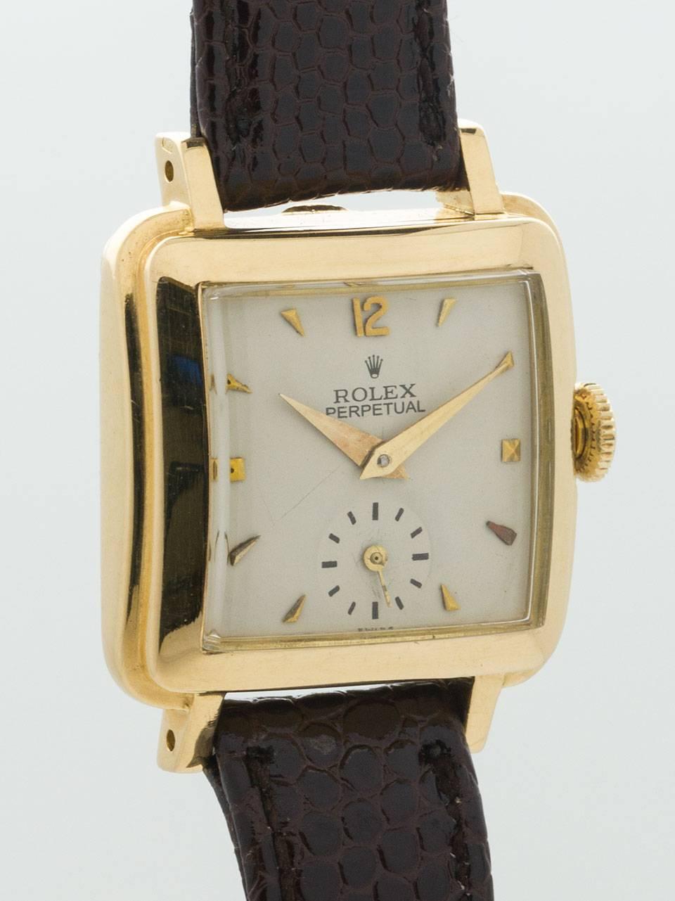 A scarce vintage Lady Rolex Square Bubbleback 18K Yellow Gold Wristwatch ref 4663 circa 1950. Featuring 24.5 X 31mm square, stepped thick case with extended lugs and curved crystal. With very pleasing restored antique white dial with gold applied