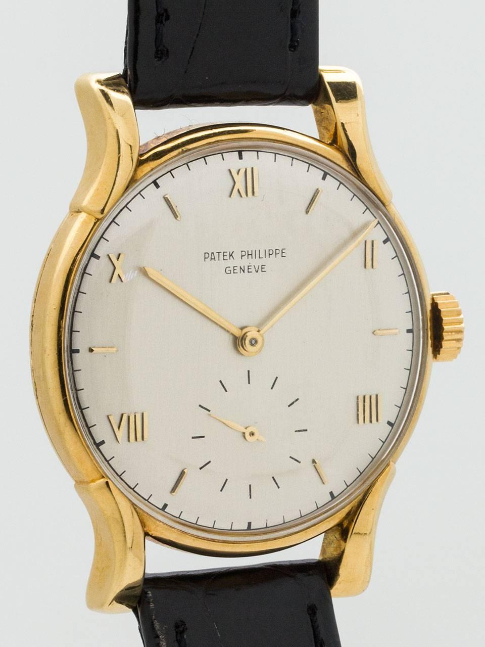Large and great styling vintage man’s wristwatch Patek Philippe 18K Yellow Gold Wristwatch ref 1596 circa 1950. Featuring 35 X 43mm case with heavy bowed lugs and acrylic crystal. Nicely restored silvered satin dial with gold applied Roman number