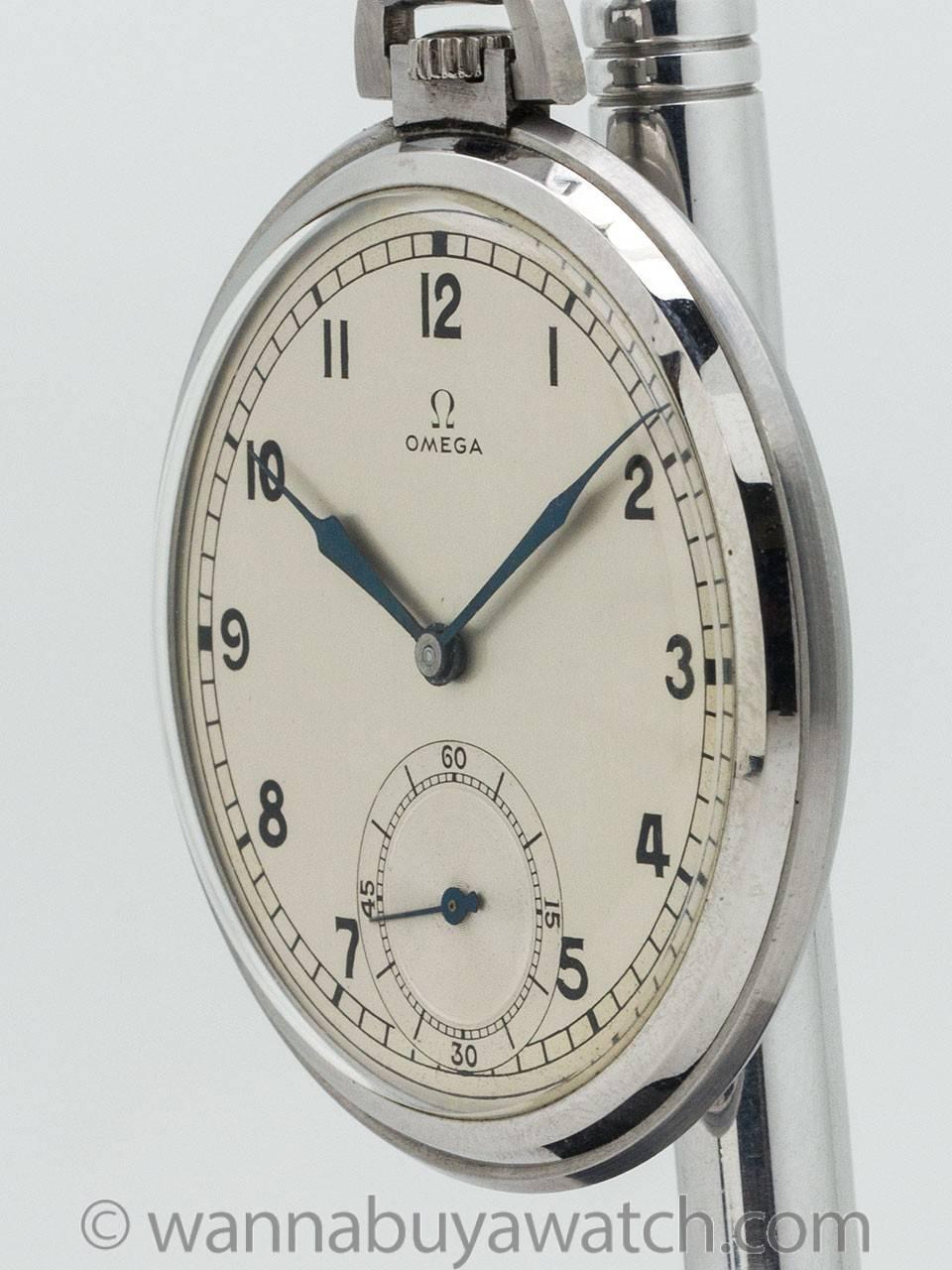 Omega man’s 12 size open face pocket watch circa late 1930s. Featuring 48mm diameter stainless steel case in very nice unpolished condition. With original matte silvered dial with black Arabic numerals and blued steel spade hands. Powered by 15