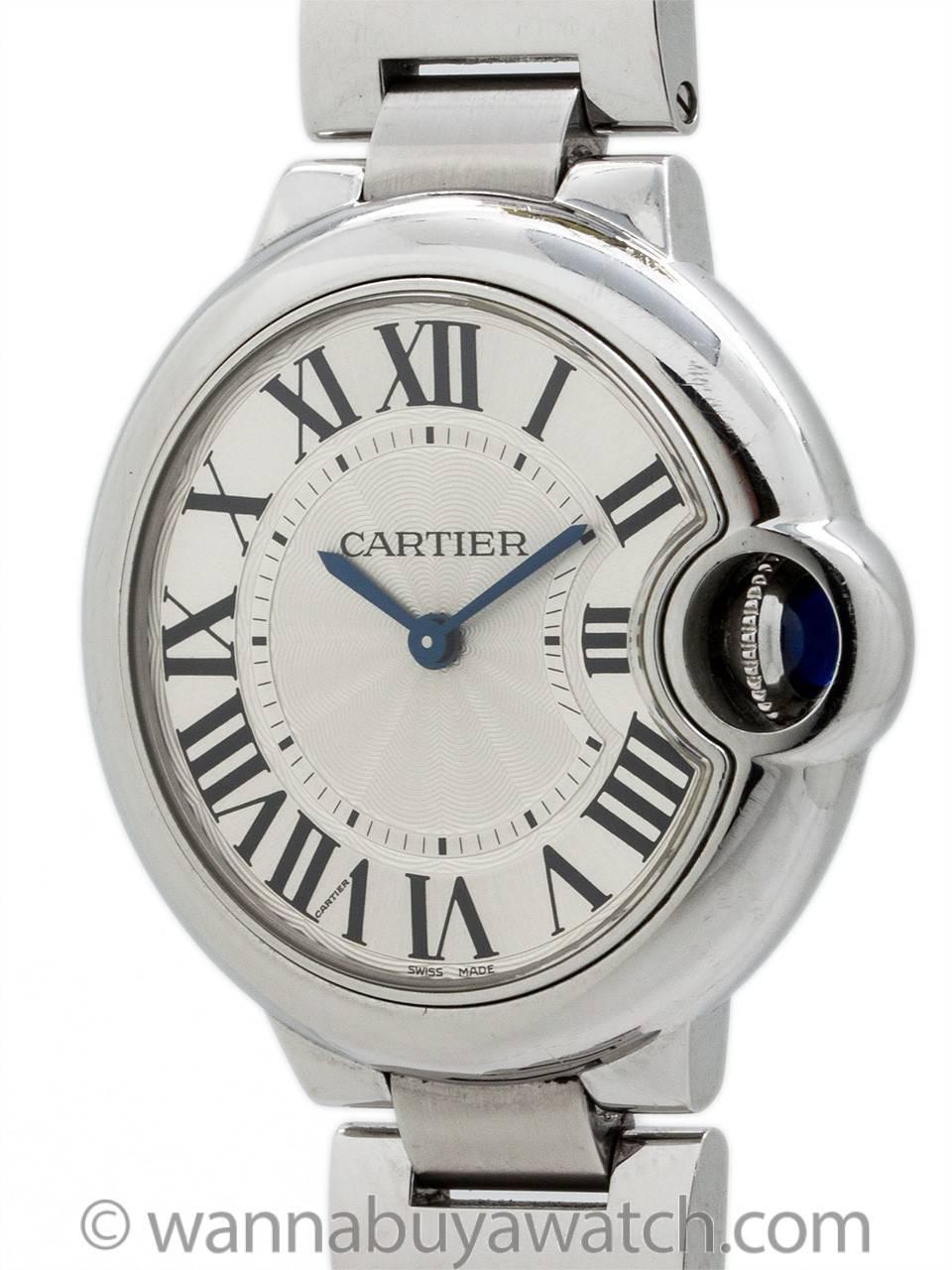 Cartier Stainless Steel Ballon Blue ref 3653 circa 2000’s. Featuring 33 X 35mm diameter case with smooth bezel, sapphire crystal and protected blue sapphire cabochon crown. Classic silvered guilloche dial with large printed black Roman numerals and