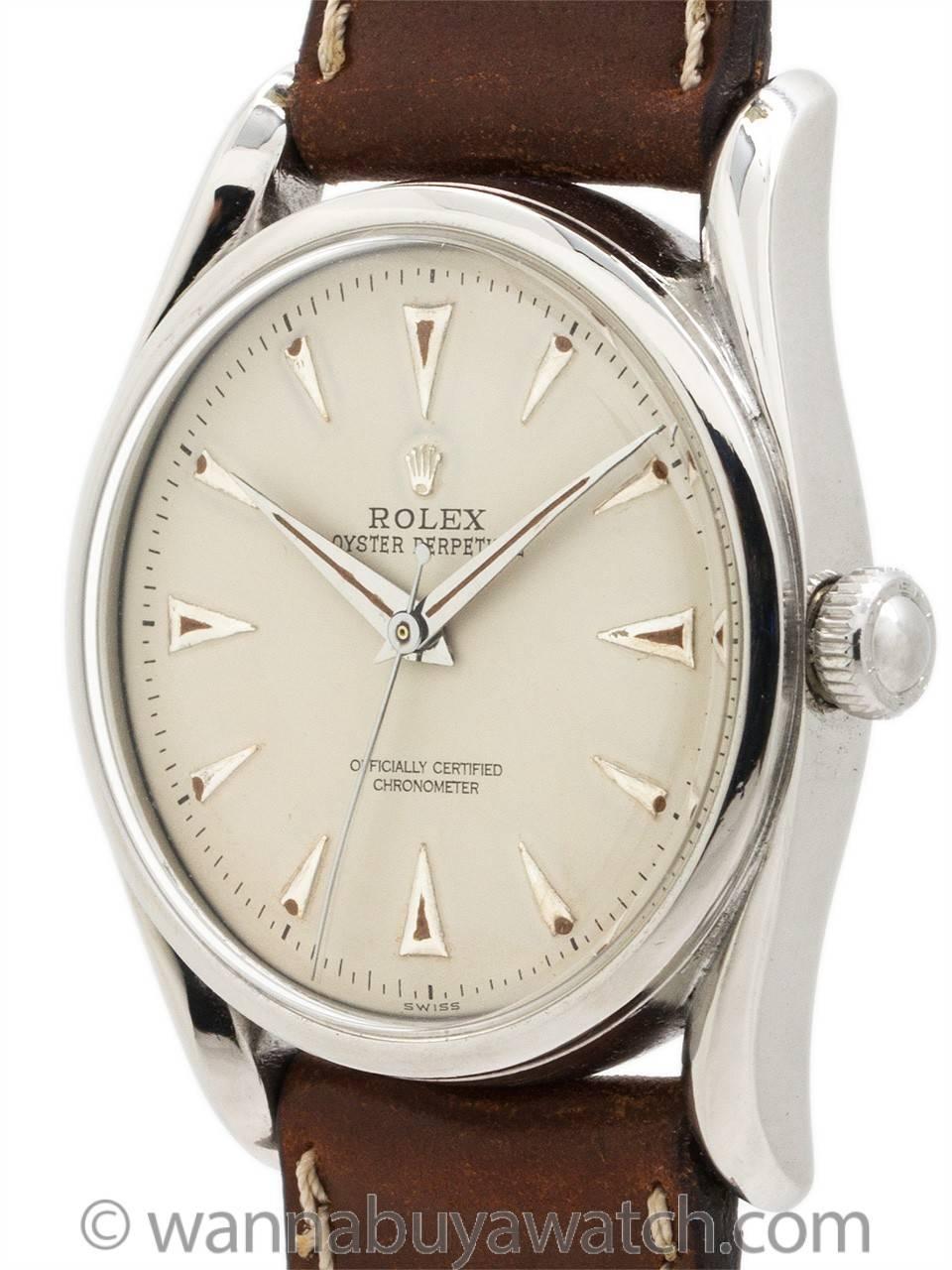 Scarce and desirable model Rolex stainless steel “Bombe ref 5018 serial # 608,xxx circa 1948. Featuring 35mm diameter Oyster case with extended bowed lugs, smooth bezel, acrylic crystal, and very pleasing refinished antique white dial with raised