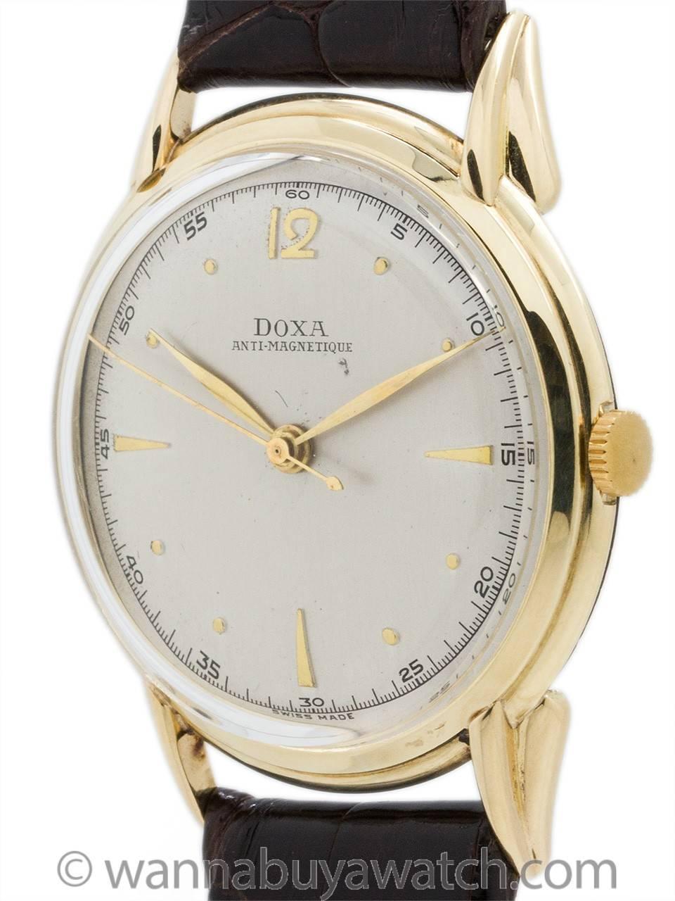 Vintage man’s Doxa dress watch circa 1950’s. Very nice looking, large for the era 36 X 42mm 4K gold case with wide stepped bezel, extended curved lugs. Case design resembles a Patek Philippe case, featuring acrylic crystal, and original matte