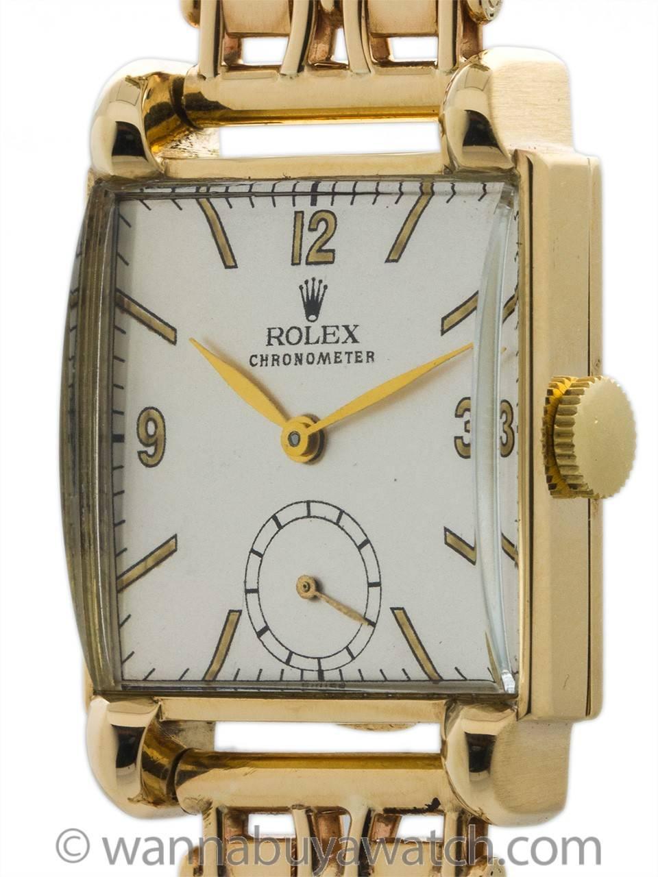 Vintage Rolex manual wind dress model ref# 4307 14K YG circa 1950’s,, Featuring 28 x 36 square case with extended horn lugs, dome glass crystal, and professionally restored matte silvered dial with gold mirror printed figures and gilt leaf style