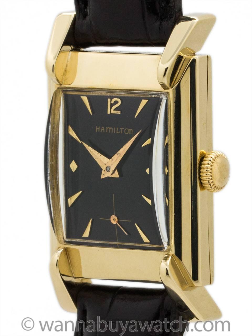 Scarce model man’s Hamilton “Drake” 14K gold circa 1951. Featuring 25 X 39mm sculpted case with flared “grasshopper” lugs, wide bezel, domed crystal, and glossy black restored dial with applied gold indexes and tapered gilt hands. Powered by