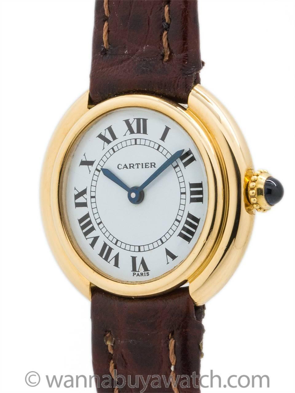 Lady’s Cartier 18K gold “Vendome tank” circa 1970’s. Featuring a 26 x 23mm round case with rounded stepped case design. Featuring white gloss dial with classic Cartier Roman figures, blued steel hands, and powered by 17 jewel manual wind movement
