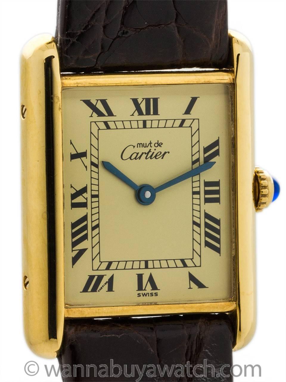Cartier Man’s Tank Louis circa 1990s. Featuring 20.5 x 28mm vermeil (20 microns gold over silver) case secured by 4 case back and 4 case side screws. Featuring classic cream color dial signed Must de Cartier with printed black Roman numerals and
