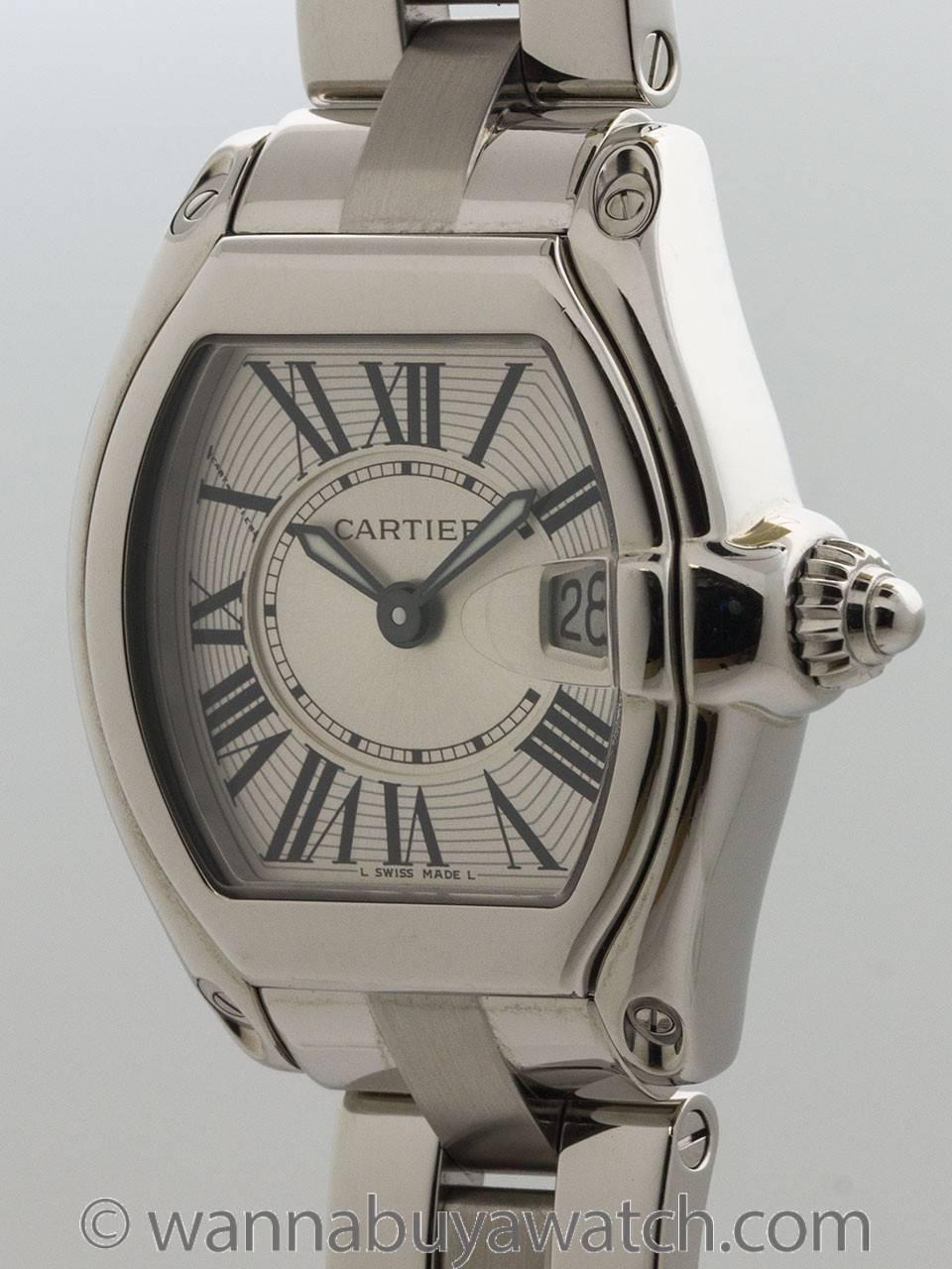 Cartier SS Roadster circa 2005 silvered dial with Roman figures quartz battery powered movement with Cartier bracelet with butterfly deployment clasp. Great looking robust design, ideal midsize for a woman. Guaranteed genuine, serviced by one of our