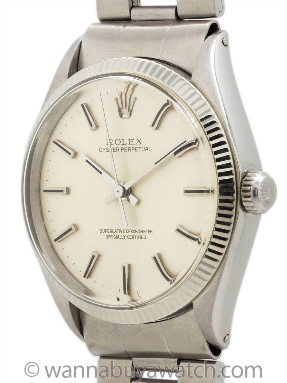 Rolex Oyster Perpetual ref 1005 circa 1971. Makes a wonderful gift for commemoration of 1971 birthday or anniversary. Featuring 34mm diameter case with 14K white gold fluted bezel, acrylic crystal, and original silvered satin dial with applied