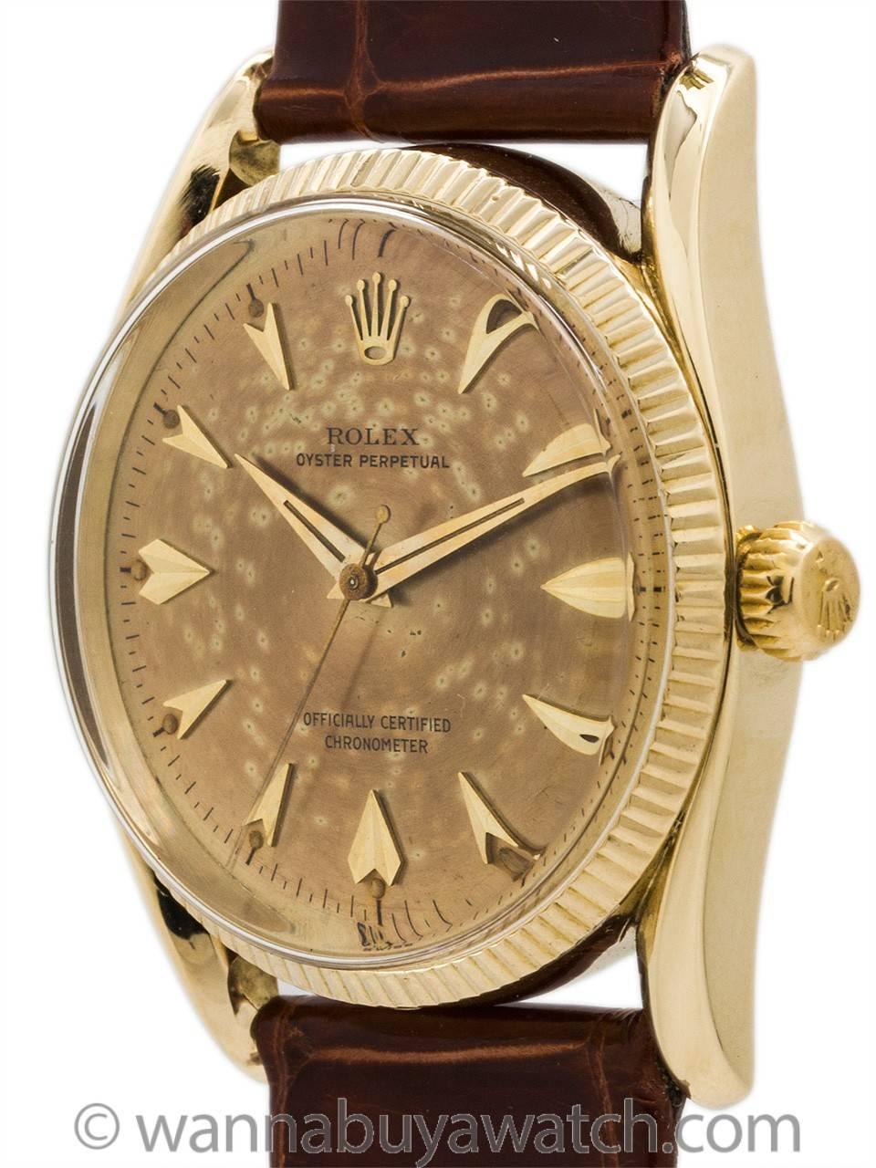 Rolex Oyster Perpetual so called  “Bombe” model 14K gold ref # 6593 serial# 172,xxx circa 1956. Featuring 34 x 40mm Oyster case with prominent bowed lugs, fine fluted bezel, acrylic dome style crystal, and beautiful and richly patina’d original