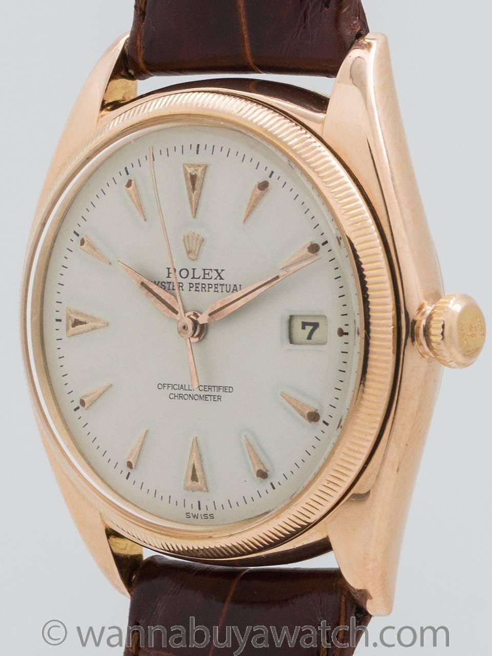 Rolex 18K rose gold Datejust ref# 4417 circa 1957. Featuring 36mm diameter case with 18K rose gold finely milled bezel. With acrylic crystal without cyclops date magnifier, and with nicely restored antique white dial with pink applied dagger shaped