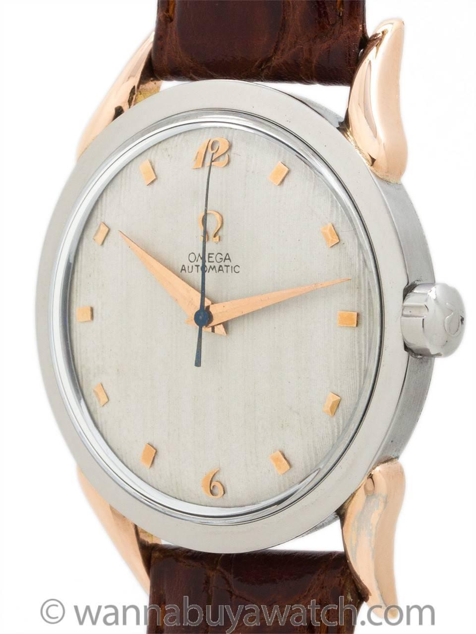 Great looking Omega man's model ref# 2597-1 automatic circa 1947 featuring 33mm diameter case with screw down case back, steel case, and rose gold curved lugs circa 1947. Very attractive 2 tone design case, acrylic crystal, nicely restored matte