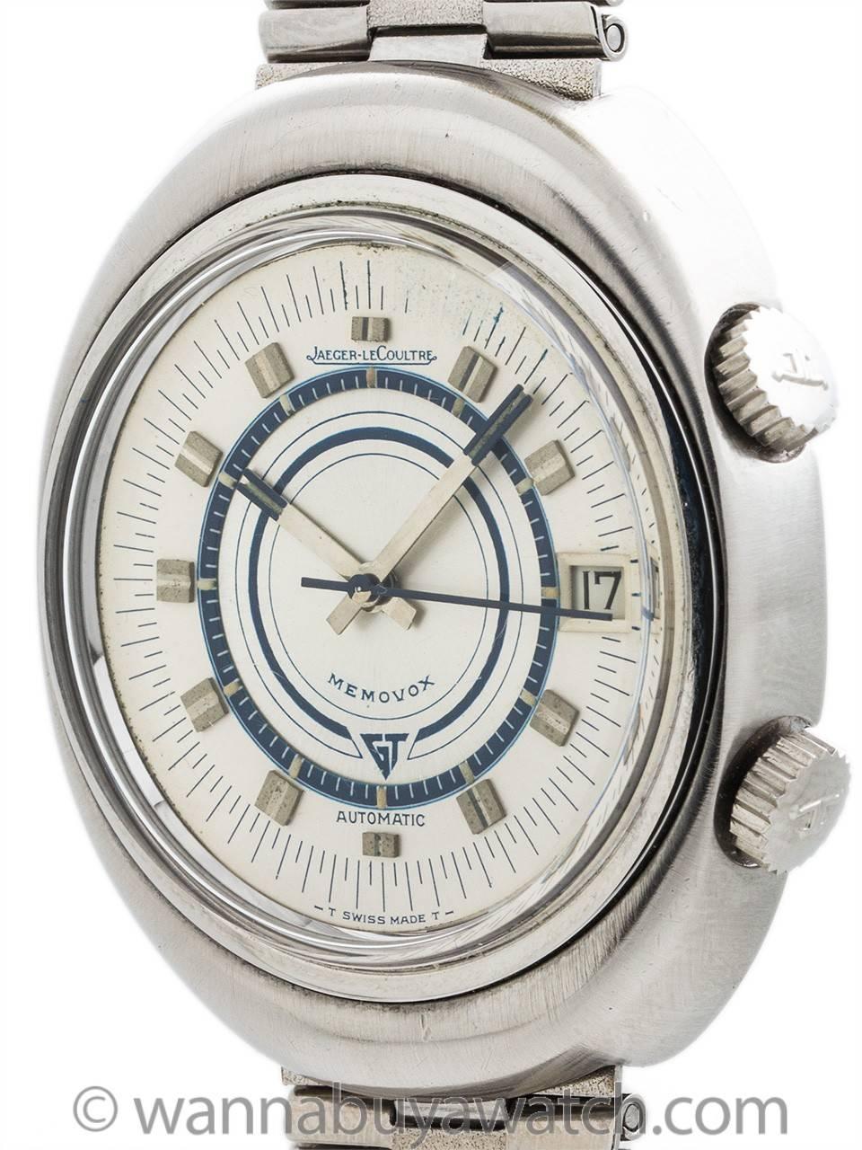 Great looking design Jaeger-LeCoultre stainless steel automatic wristwatch with alarm, circa 1960s. Large size oval shaped case man’s model with silvered satin dial with silvered and blue applied hands, and with original NSA bracelet with signed JLC