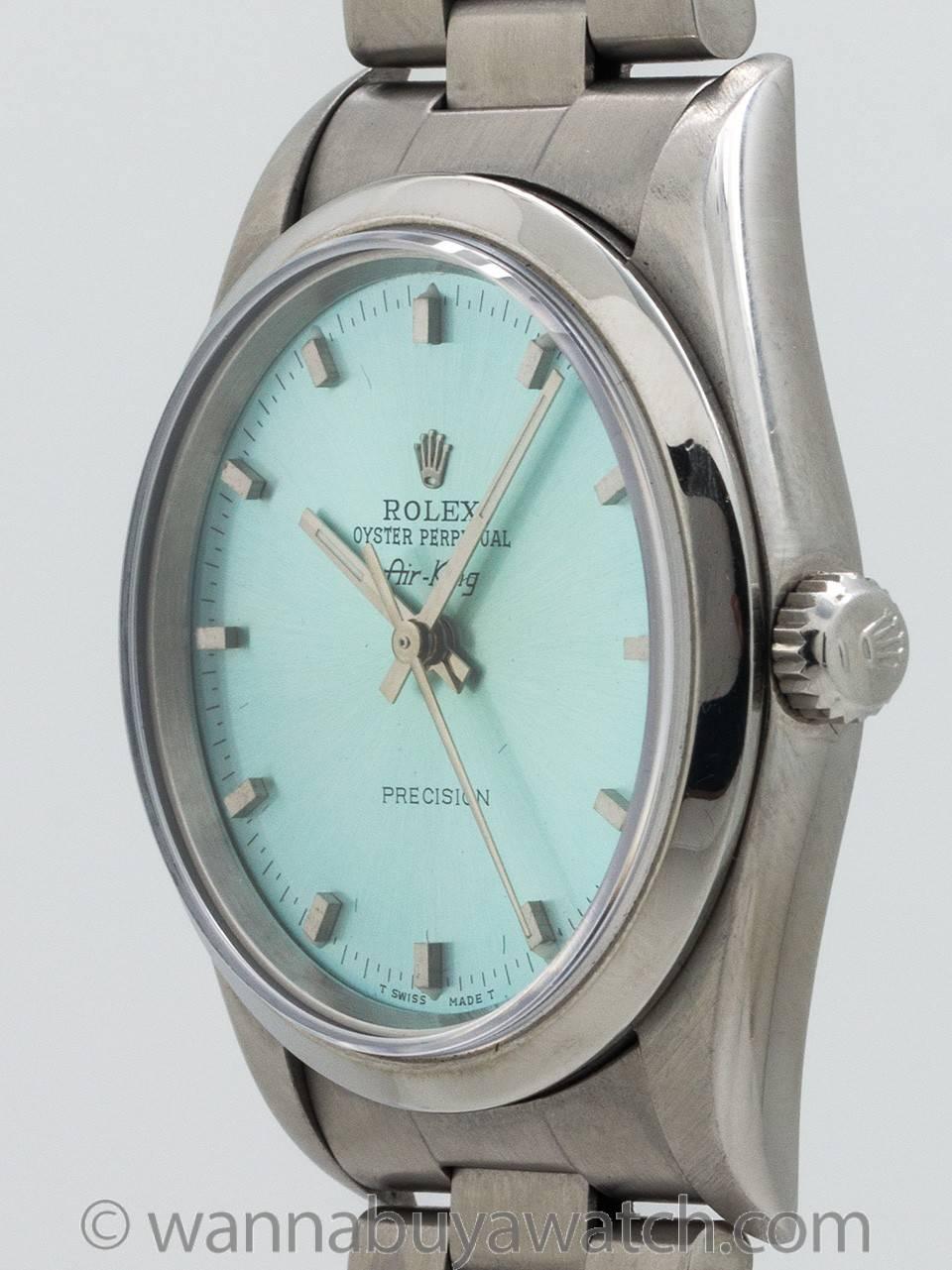 Rolex stainless steel Oyster Perpetual ref 14000 serial #T2 circa 1996. Featuring 34mm diameter Oyster case with smooth bezel and sapphire crystal. With beautiful custom colored “Ice Blue” dial with applied silver indexes and silver baton hands.