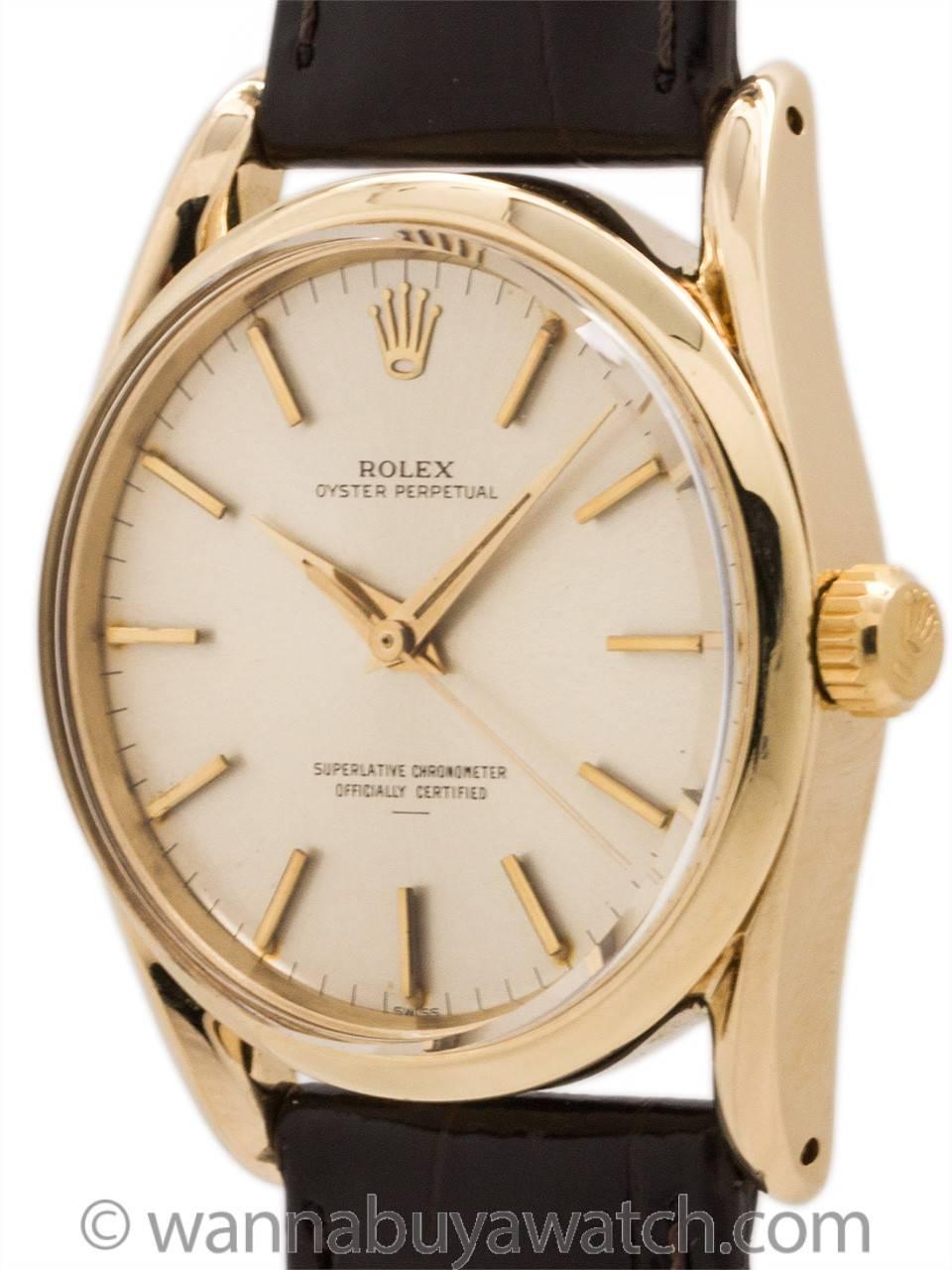 Rolex Oyster Perpetual so called  “Bombe” model 14K gold ref # 1010 serial# 100,xxx circa 1964. Featuring 34 x 40mm Oyster case with bowed lugs, smooth bezel, acrylic dome style crystal, and beautiful  condition original matte silver dial with