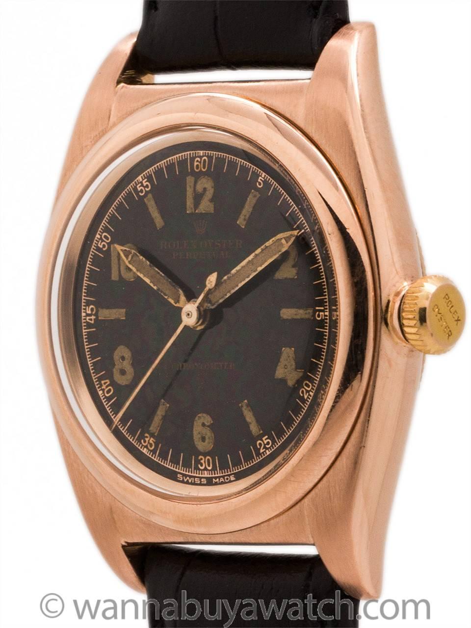 Great looking vintage man’s Rolex Bubbleback 14K Rose Gold ref 3131 case serial # 444,xxx circa 1946 with very desirable original black luminous dial. Featuring 32mm diameter Oyster case with screw down caseback, screw down crown, smooth bezel,