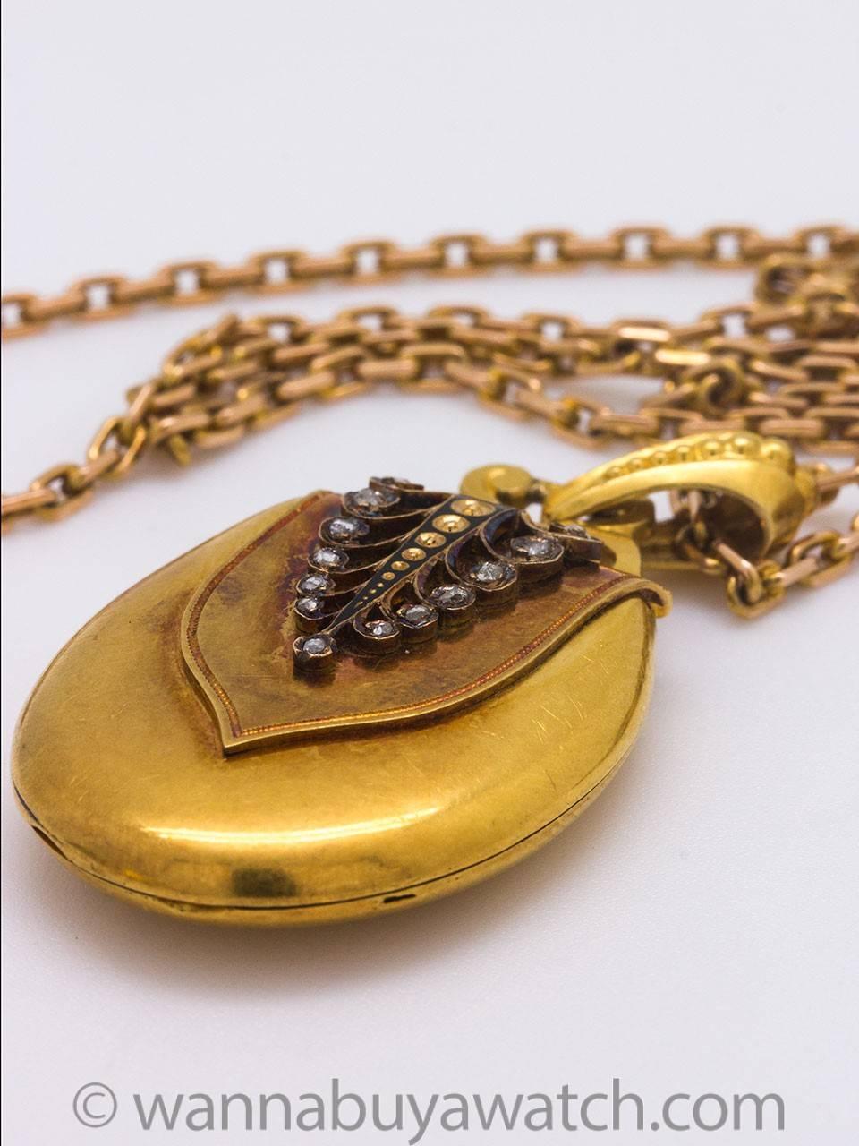 Stunning Victorian 18k yellow gold teardrop diamond locket with lovely organic swirl motif, set with 16 rose cut diamonds. Stones measure from 1-2 millimeters each, with an approximate total weight of .20ct. Locket is 25mm wide x 39mm long, 8mm