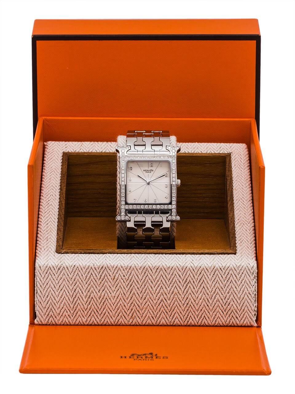 Stunning 26mm x 35mm Hermes Heure H diamond and stainless steel watch with Swiss quartz movement. Classic Hermes design, with sleek 20mm H link staineless steel bracelet with double deployment clasp, which fits up to a 6.5 inch wrist. Comes complete