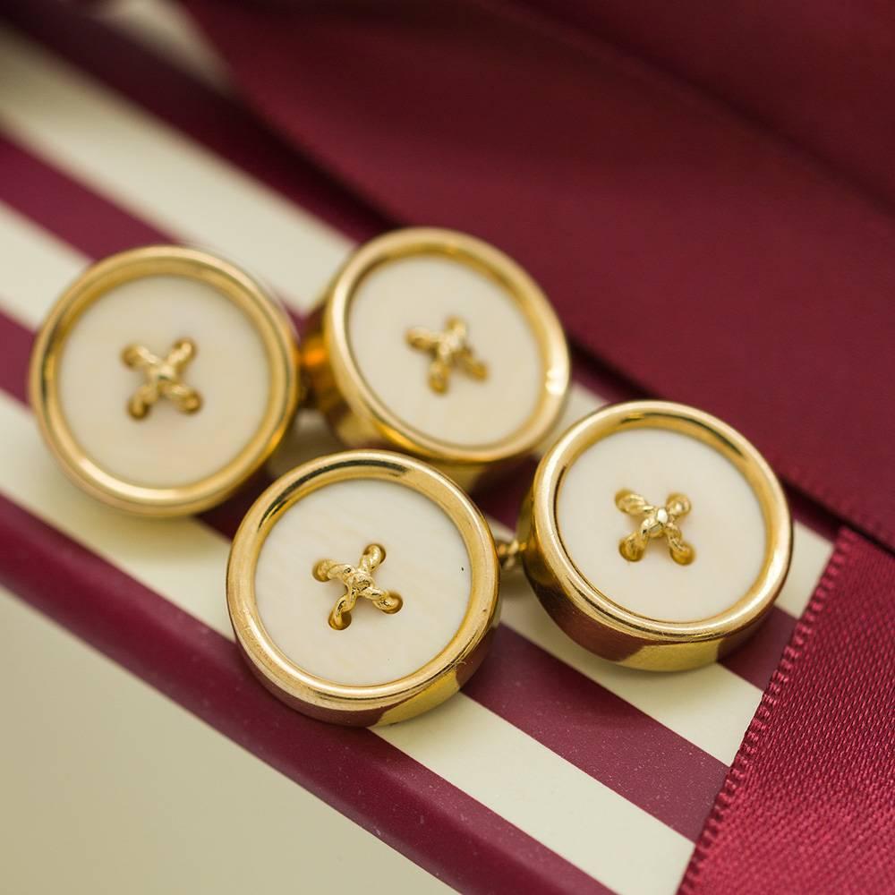 Tiffany & Co 18K YG button style cufflinks circa 1950’s. Classic chunky design with thick and rounded button design with bone center and twisted 18K YG threads. Signed 18K YG and Tiffany on backs. Classic, rich design with weighty, substantial