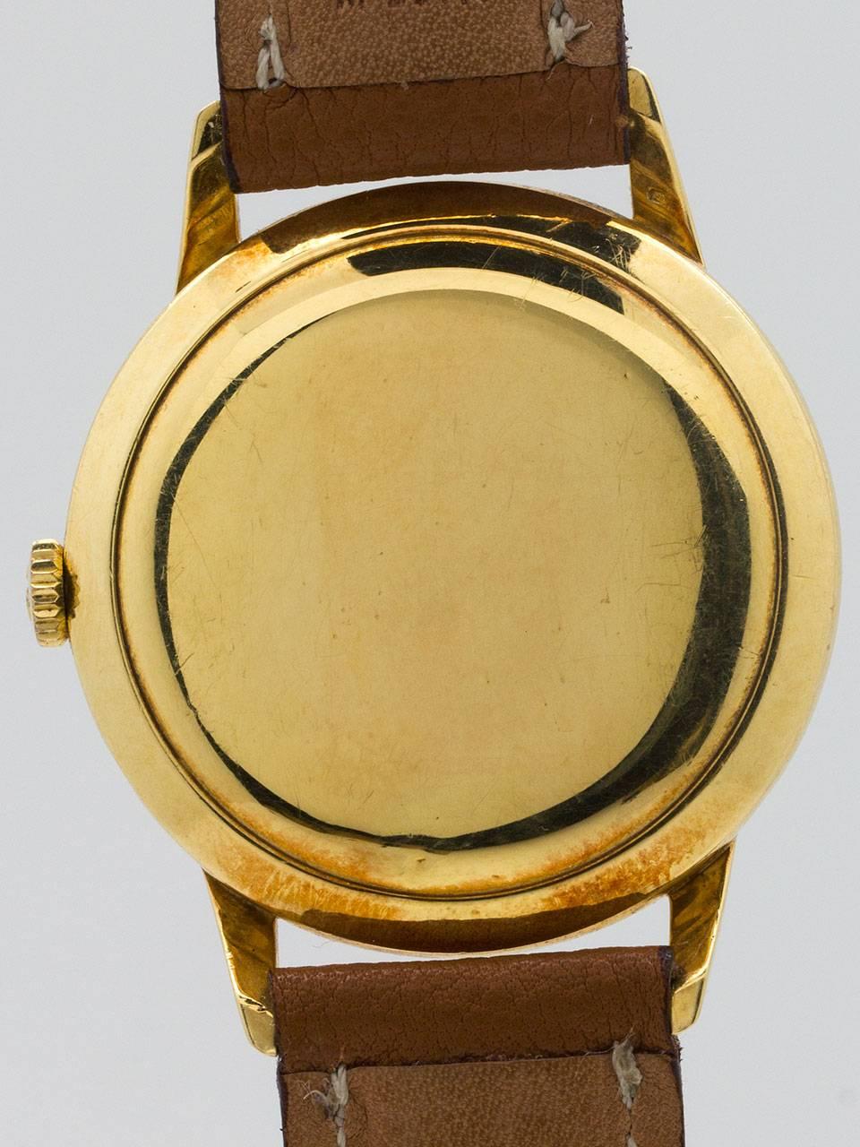 Omega  Yellow Gold Dress Model Textured Dial Manual Wristwatch circa 1950s In Excellent Condition For Sale In West Hollywood, CA