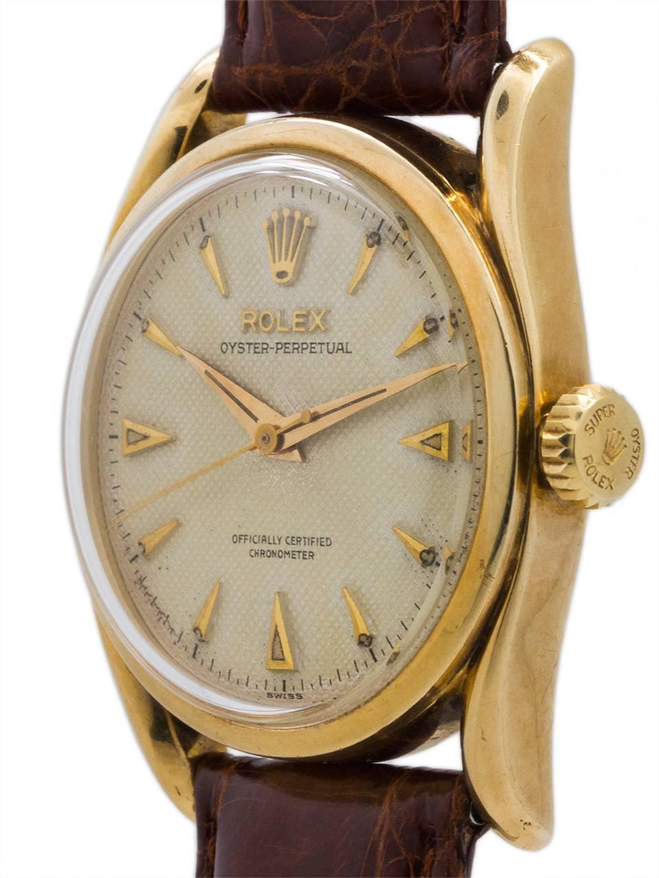 Stunning Rolex 14K YG Oyster Perpetual Bombe ref # 6092 circa 1952 with stunning original antique white waffle dial. Featuring a 35mm diameter Oyster case with bowed “bombe” style turned lugs, acrylic crystal, original “super Oyster” crown, and with
