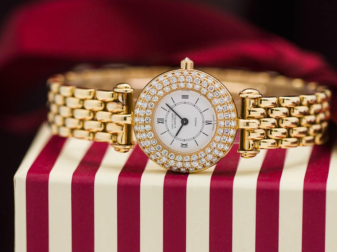 Van Cleef & Arpels 18K YG diamond set lady’s sport model. Beautifully designed and finely executed lady sporty size model set with 3 rows of fine diamonds and diamond set crown. With heavy rice link style bracelet with hidden deployment clasp.