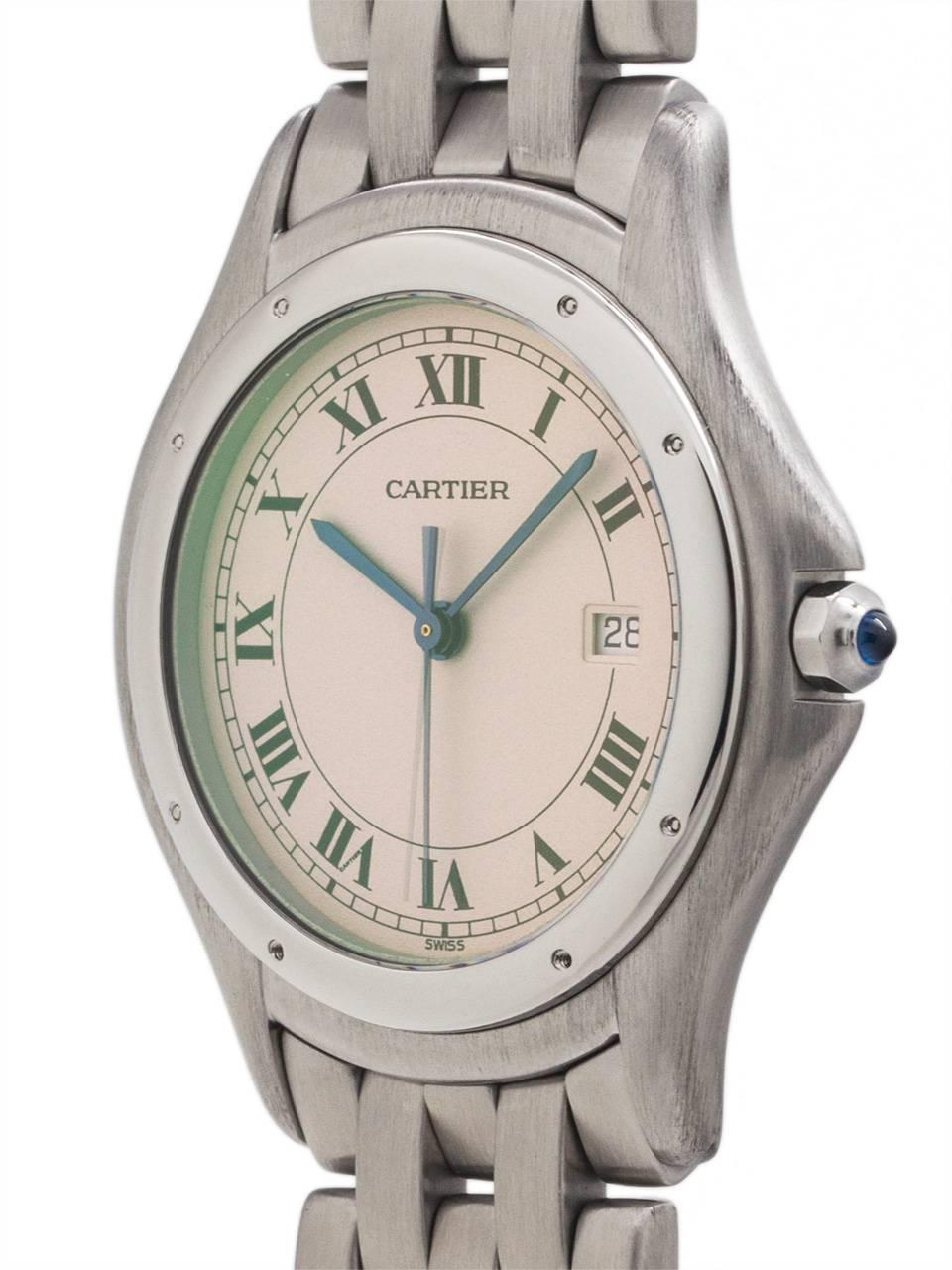Cartier man’s Cougar model stainless steel circa 1980’s. Featuring round 32 X 36mm case with rounded stepped bezel secured by screws, antique white dial with classic Cartier Roman figures and blued steel hands. Powered by quartz movement with sweep