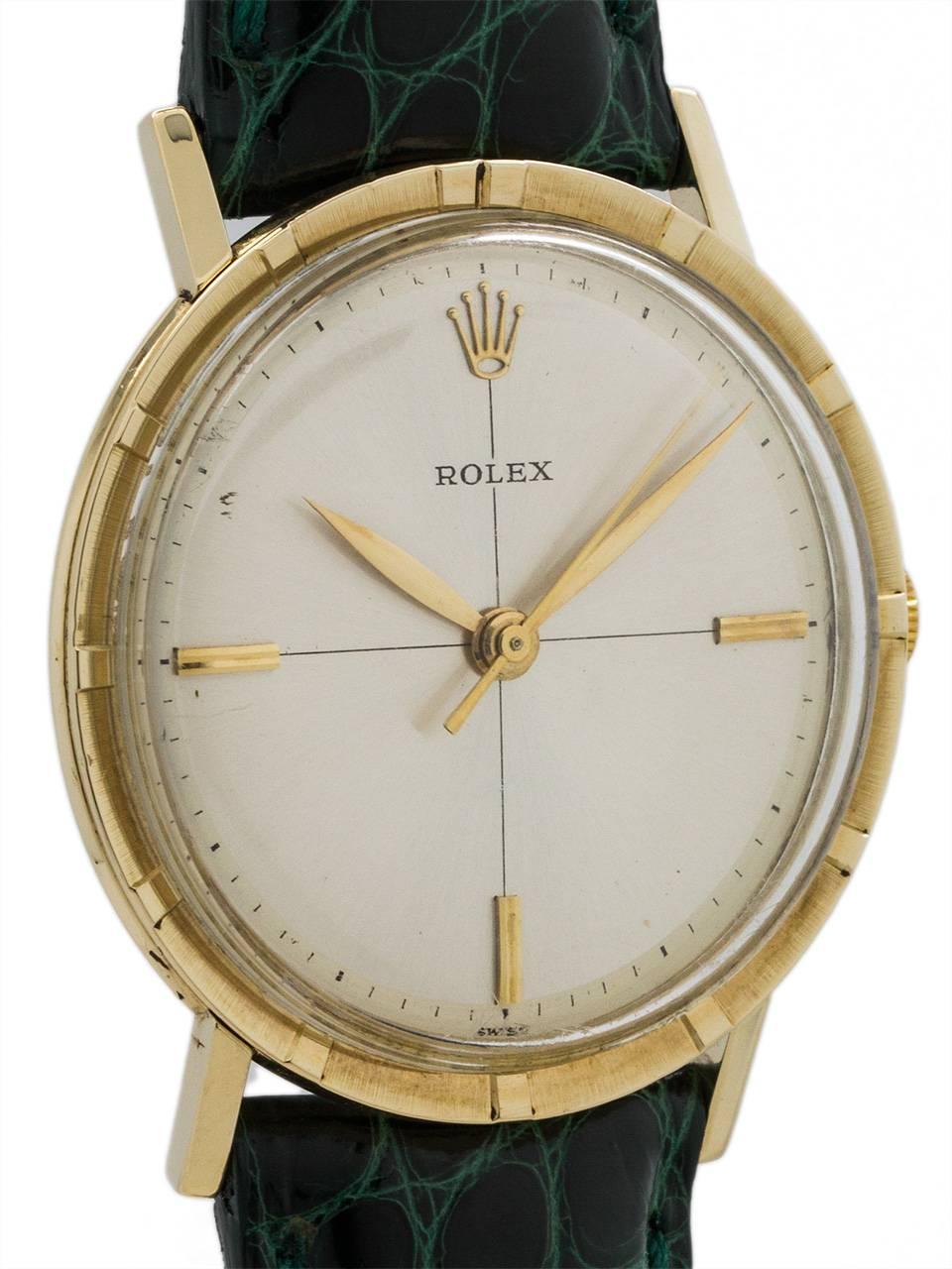 Vintage Rolex 14K gold manual wind dress model circa 1960’s. Featuring a modernist design 34 X 39mm case with wide engine turned bezel, acrylic dome crystal, and beautiful original minimalist silver satin dial with applied gold indexes and tapered