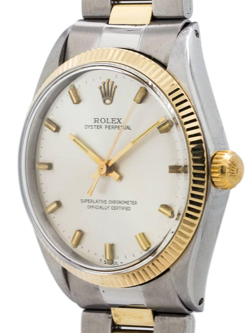 Rolex Stainless Steel and 14K yellow gold Oyster Perpetual ref 1005 serial #2.0 million circa 1971. Featuring 34mm diameter case with fine engine turned “milled” bezel and acrylic crystal. With original silvered satin dial with applied gold indexes