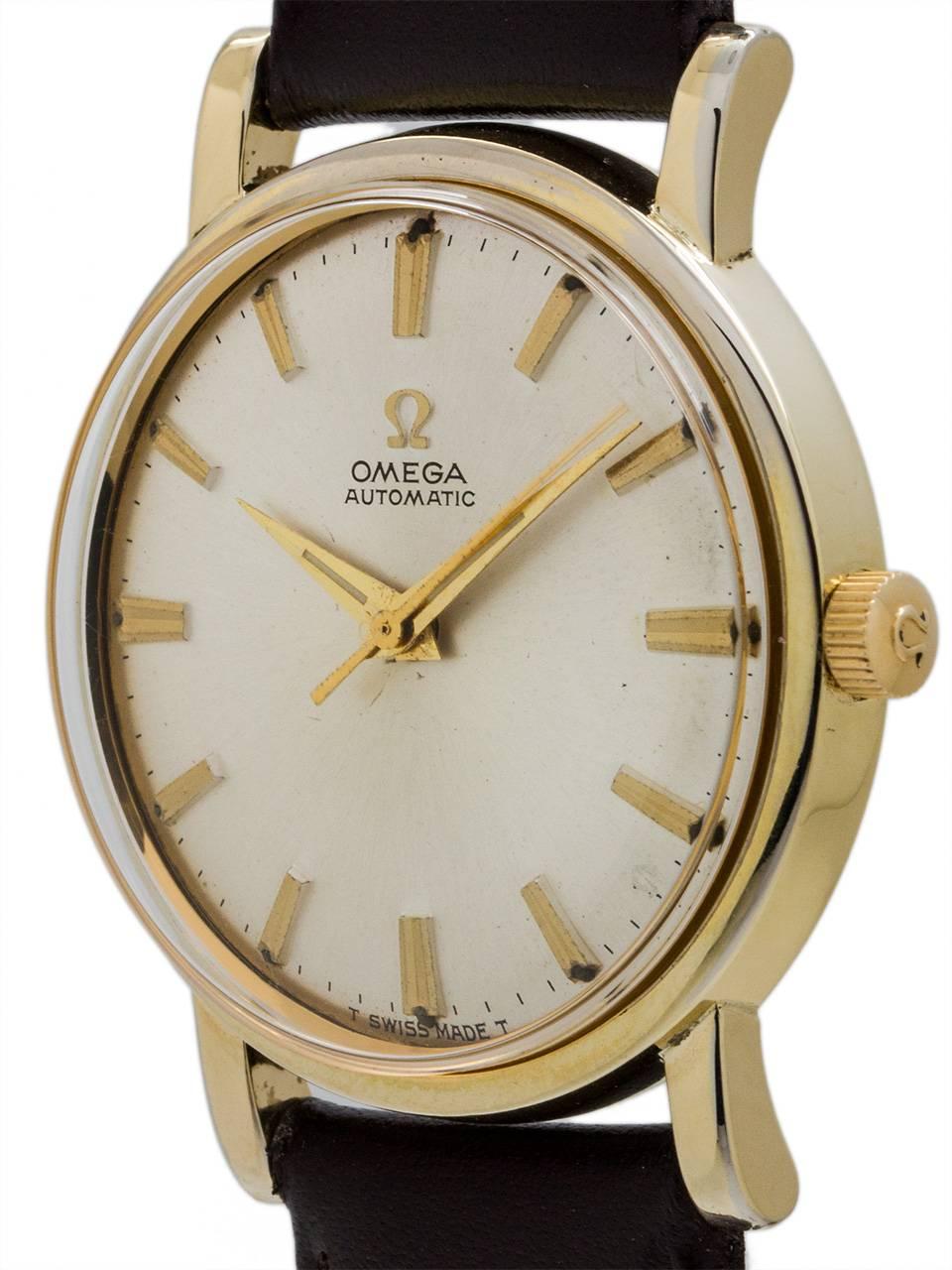 Man’s Omega automatic ref 6289 circa 1969. Featuring 33 x 39mm gold filled case with screw down case back, acrylic dome crystal, and very clean original silvered satin dial with gold applied indexes, applied Omega logo, and tapered dauphine hands.