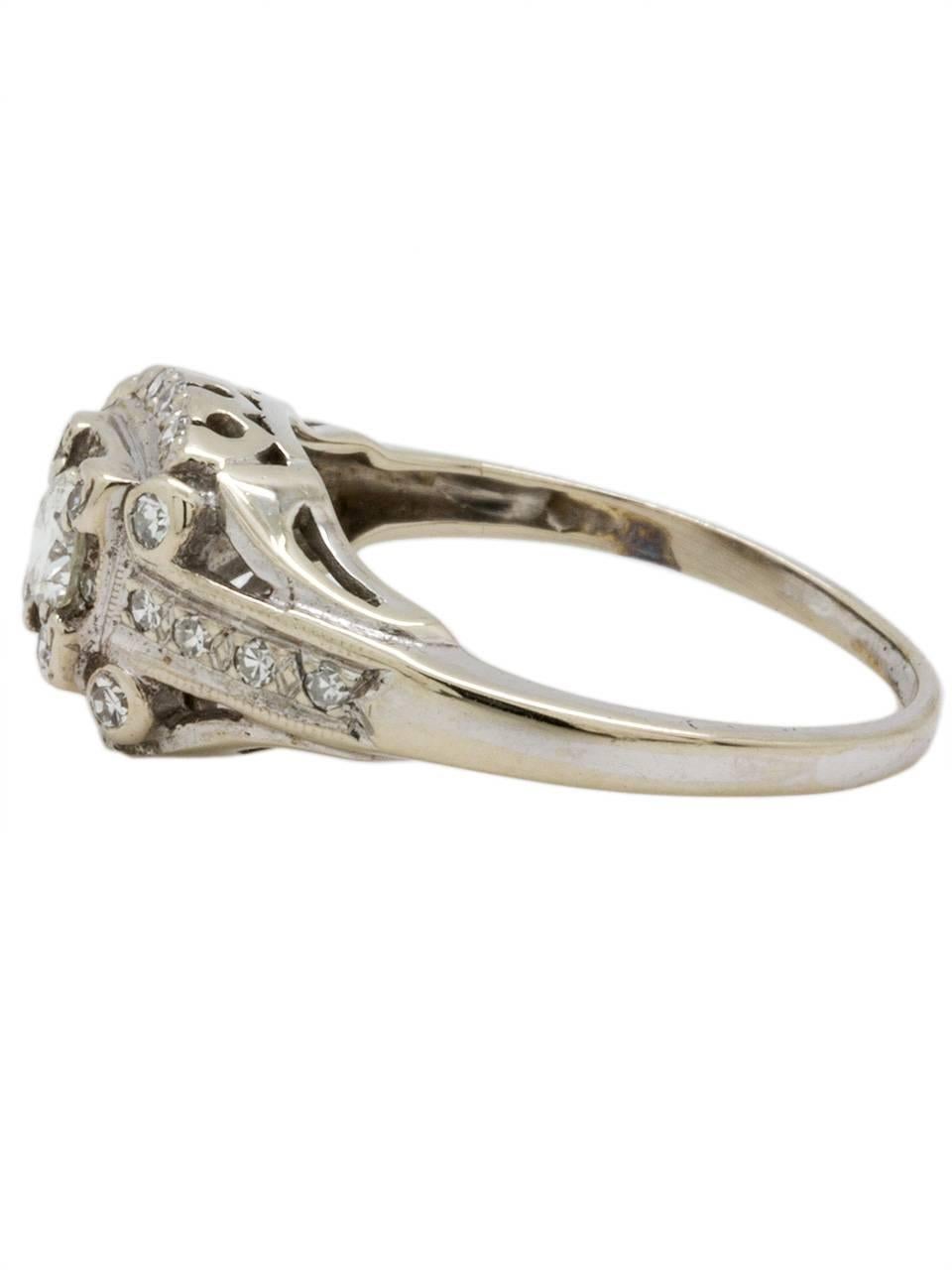 Gorgeous 1940s 18k white gold engagement ring set .30ct round brilliant cut center diamond with I color (near colorless) and exceptional VS1 clarity.  Lovely tapered design setting, with 26 bead and bezel set single-cut side diamonds, with total