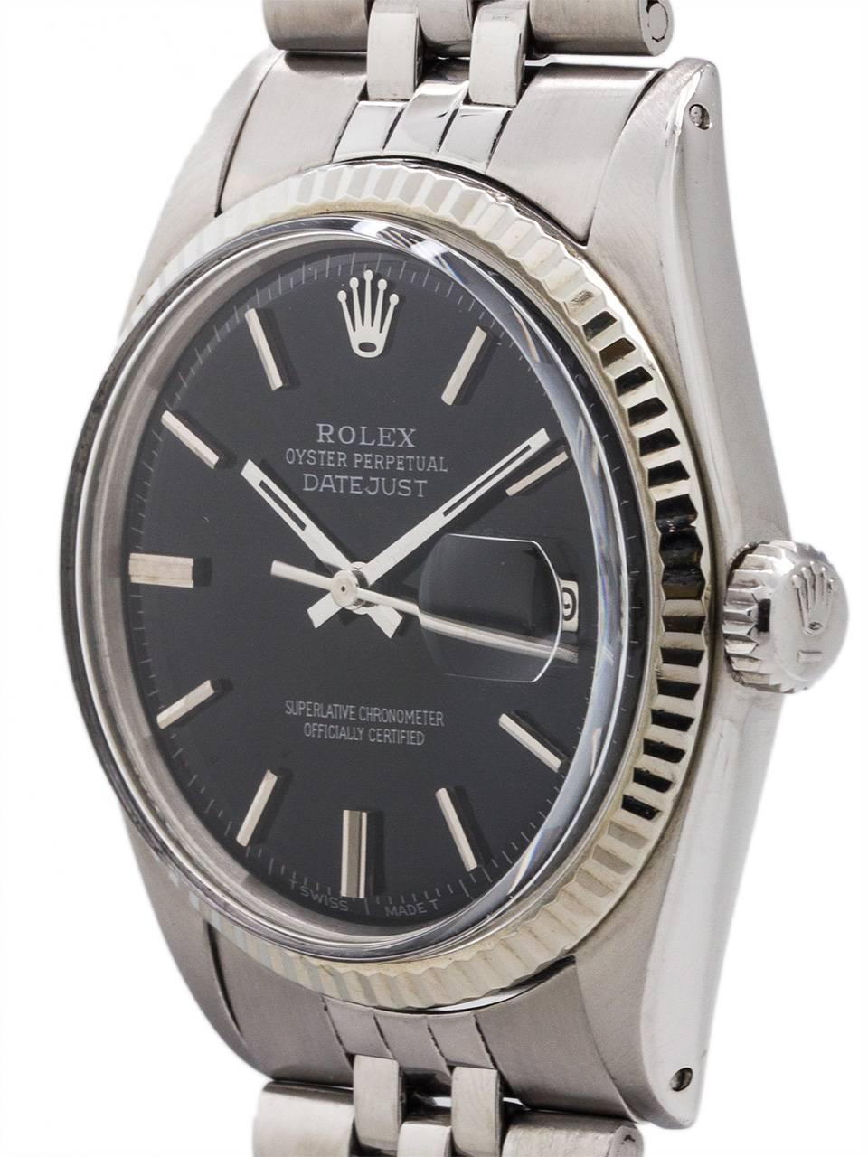 Vintage Rolex Datejust ref 1601 serial # 2.6 million circa 1970. Featuring 36mm diameter Oyster case with 14K white gold fluted bezel, acrylic crystal, and nicely restored glossy black pie pan dial with applied silver indexes and silver baton hands.