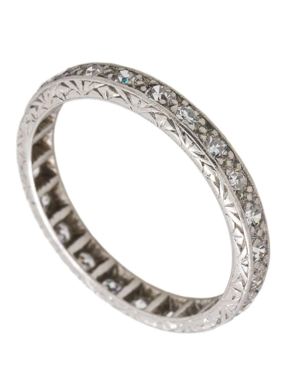 This gorgeously detailed platinum eternity band is set with 22 single cut diamonds, 0.50ct, H/SI1. This dainty ring would look perfect paired with one of our antique Art Deco engagement rings, or stacked with two or three narrow eternity bands.