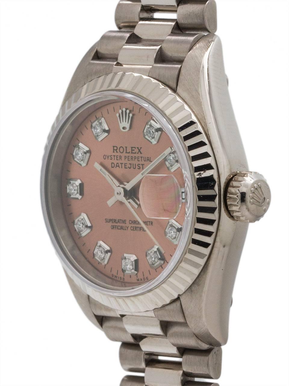 A scarce, vintage Lady Rolex 18K white gold President ref 79174 serial# K4 circa 2001. Featuring a 27mm diameter case with fluted bezel, and sapphire crystal. With custom “Ice Pink” diamond dial with applied diamond indexes & silver baton hands.