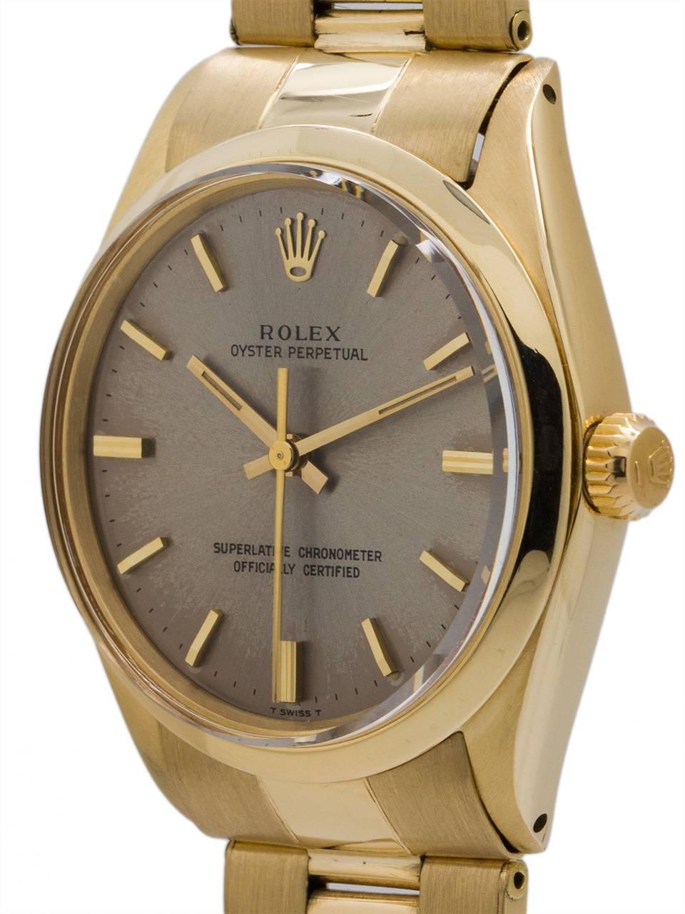 Rolex 14K YG Oyster Perpetual ref 1005 serial # 1.0 million circa 1964. Featuring a 34m diameter case with smooth bezel and acrylic crystal and scarce original gray dial with gold applied indexes and baton hands. Powered by self winding chronometer