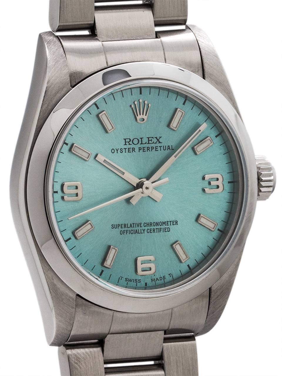 Rolex Oyster Perpetual midsize model ref 77080 stainless steel circa 2001. Featuring 31mm diameter case with smooth bezel and sapphire crystal and custom colored “Ice Blue” dial with popular 3/6/9 Explorer style configuration. Powered by self