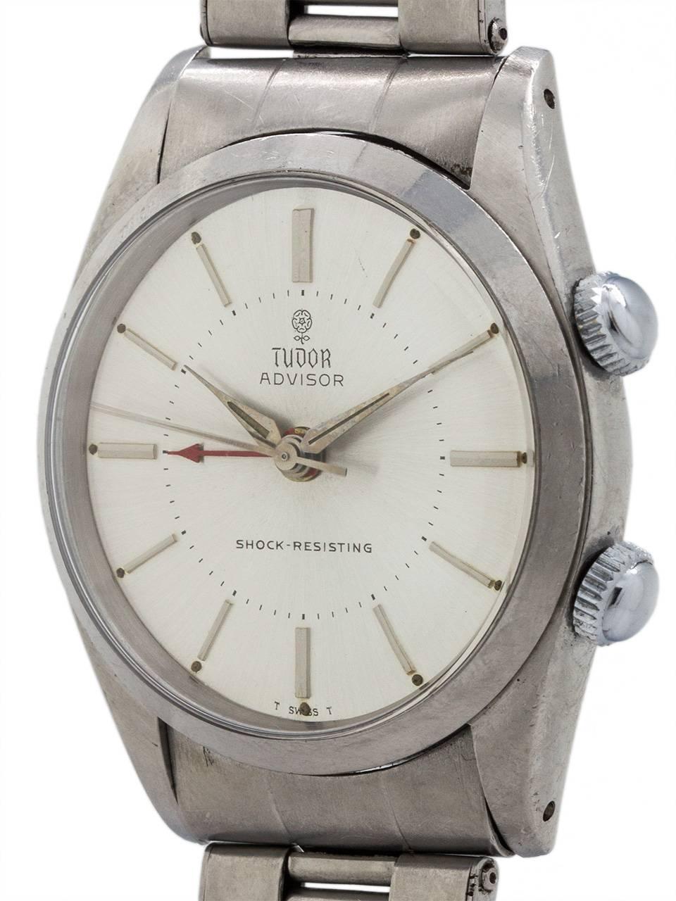 Tudor Advisor alarm model  ref 7926 featuring a 34 x 41mm stainless steel screw back case serial # 508,xxx circa 1966 with silver satin original dial signed Tudor Advisor Shock-Resisting T SWISS T, with applied silvered indexes with patina’d