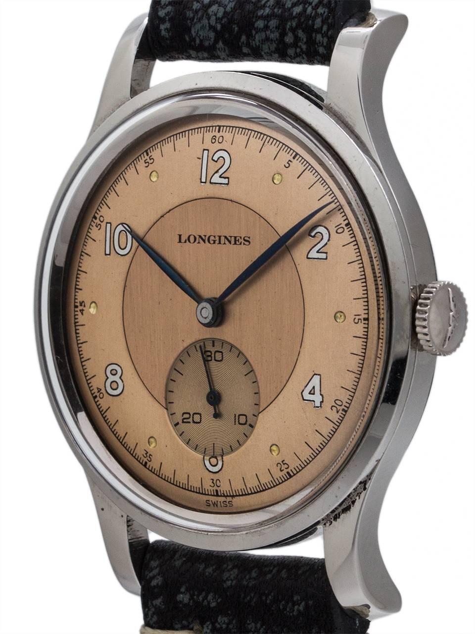 Vintage Longines Calatrava military case style model circa 1946. Featuring 35 x 43mm robust design case with sloped bezel, heavy turned lugs, and snap on caseback. With beautifully restored 2 tone rose dial with mirror printed silver indexes and