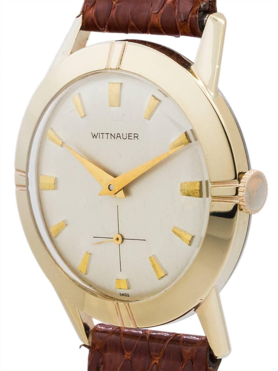Modernist design Wittnauer 17 jewel manual wind dress mode circa 1950’s. Featuring 33 x 39mm case with extended lugs and wide sloped bezel with fluted design at 1/4’s. With acrylic crystal and very clean original silver satin dial with gold raised