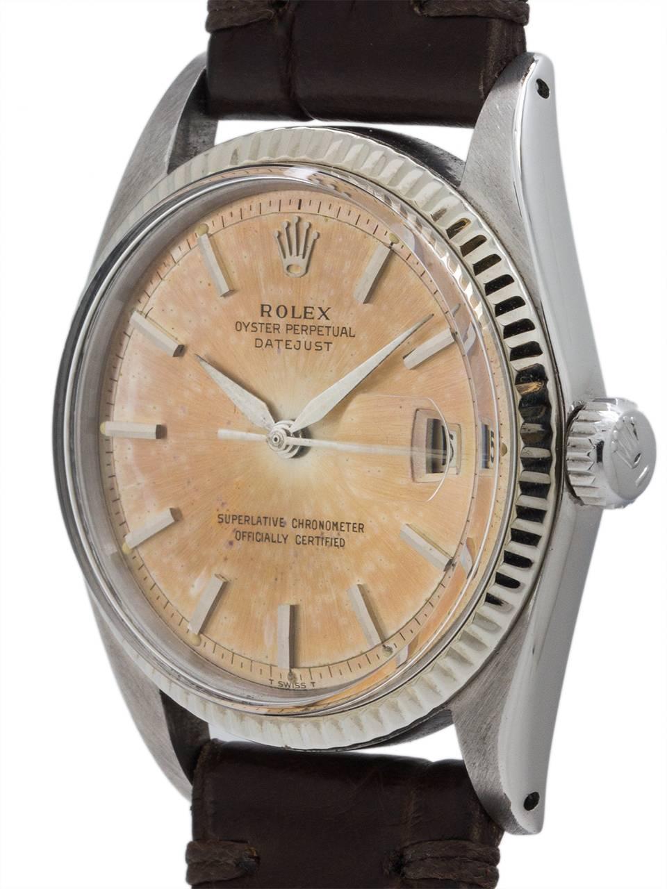 Rolex Stainless Steel Datejust ref 1601 serial # 9.3 million circa 1963. Full size man’s 36mm diameter case with 14K white gold fluted bezel and acrylic crystal with a very pleasing tropical dial with early style tapered hands. The original silver