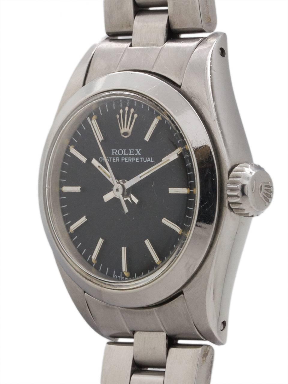 Lady Rolex stainless steel Oyster Perpetual ref 6718 serial #4.1 million circa 1976. Featuring 25 mm diameter Oyster case with smooth dome bezel, acrylic crystal, and beautiful condition matte matte black original “Sigma” dial with applied white