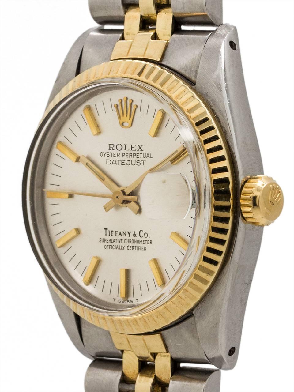 Scarce and very desirable Rolex midsize Datejust ref 6827 SS/18K YG circa 1979 retailed by Tiffany & Co. Featuring 31mm diameter case with fluted bezel, acrylic crystal and original silvered satin dial signed by retailer Tiffany & Co.