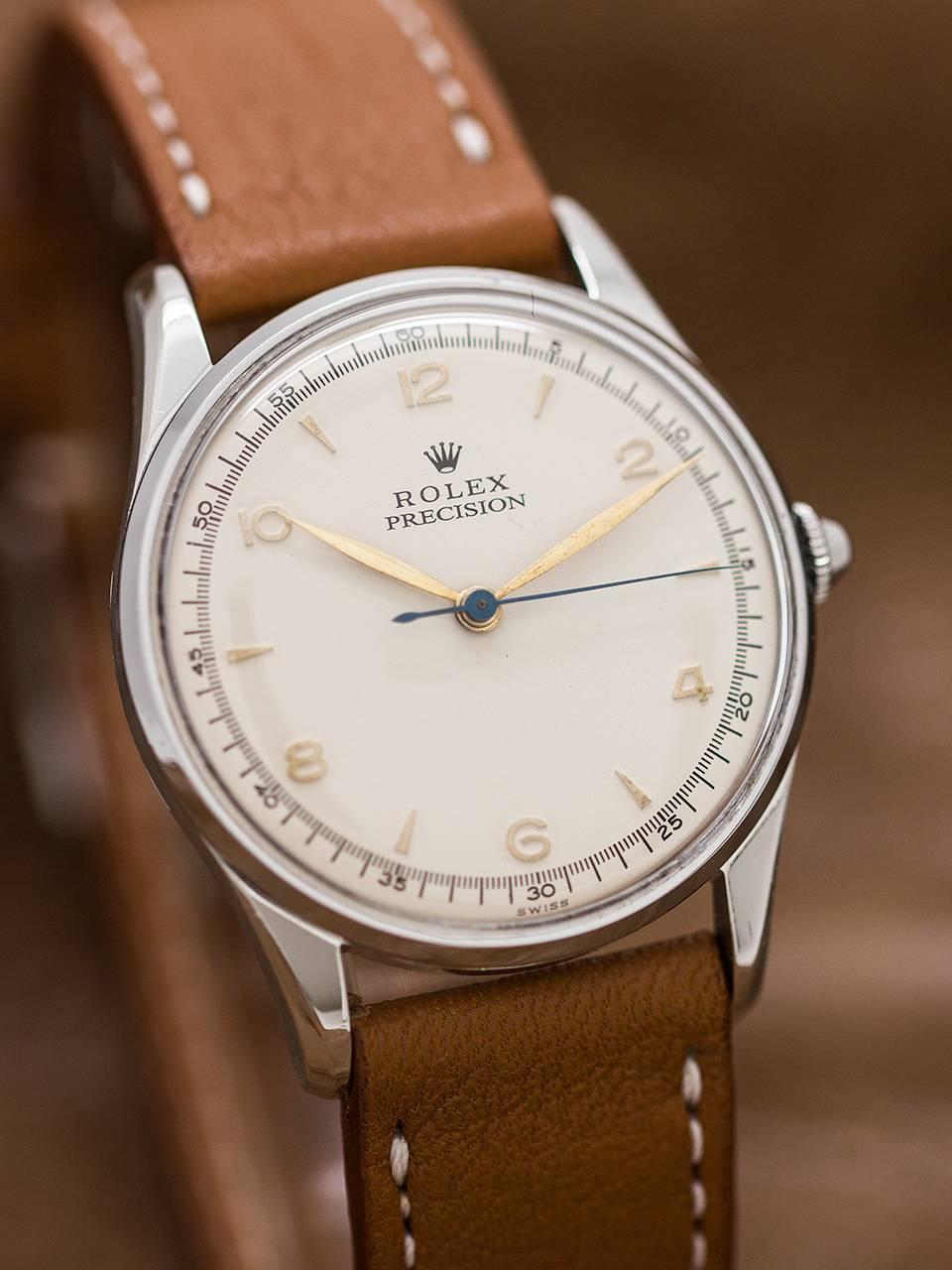 Rolex Stainless Steel manual wind dress model ref 5517 circa 1950’s. Featuring a 32 mm diameter snap back case with acrylic crystal and older antique white restored dial with raised gold numbers and indexes. With beautiful gold leaf hands, and a