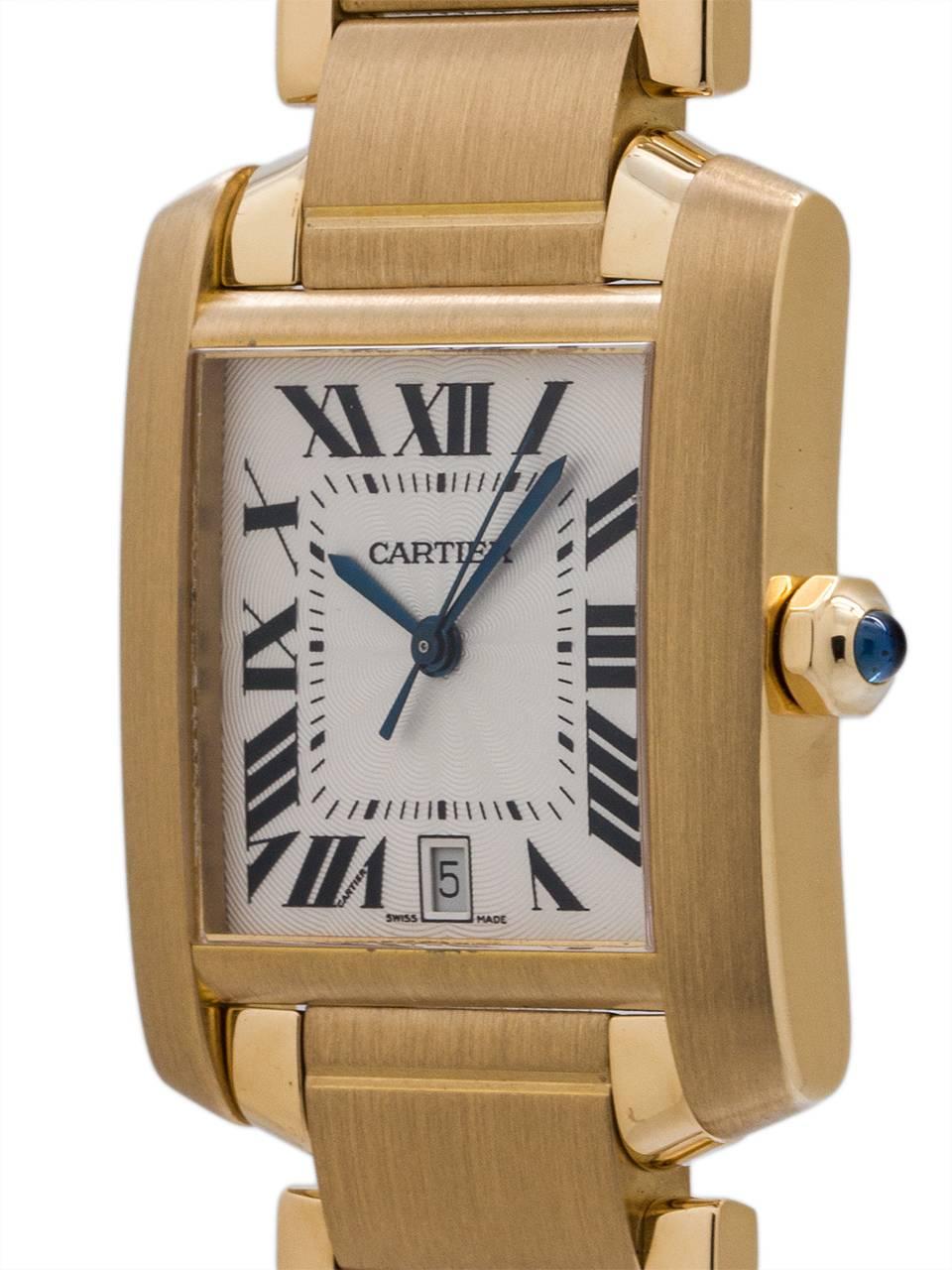 Cartier Tank Francaise 18K YG man’s full size automatic circa 2005. Measuring 28 x 42mm featuring guilloche textured silvered satin dial with black Roman figures, blued steel hands, and cabochon sapphire crown. Powered by self winding movement with