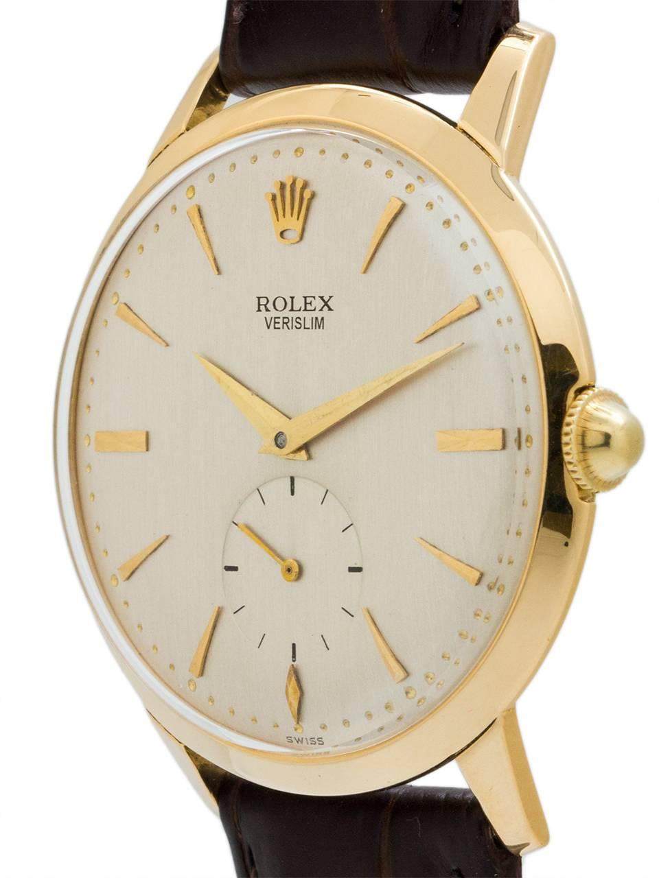 Vintage Rolex dress model “Veri Slim” 18K YG circa 1950’s. Featuring 34mm diameter case with wide bezel and extended lugs and beautifully restored antique white textured dial with gold applied indexes and Rolex crown logo and elongated tapered
