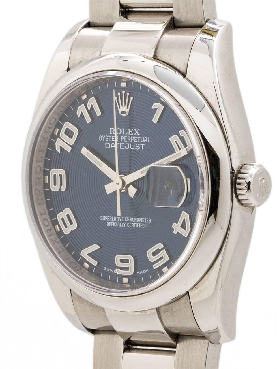 Preowned Rolex Datejust ref 16200 stainless steel circa 2002. Featuring 36mm diameter case with smooth dome bezel, sapphire crystal, and beautiful original blue sunburst dial with wrapping roman numeral indexes and silver baton hands. Powered by