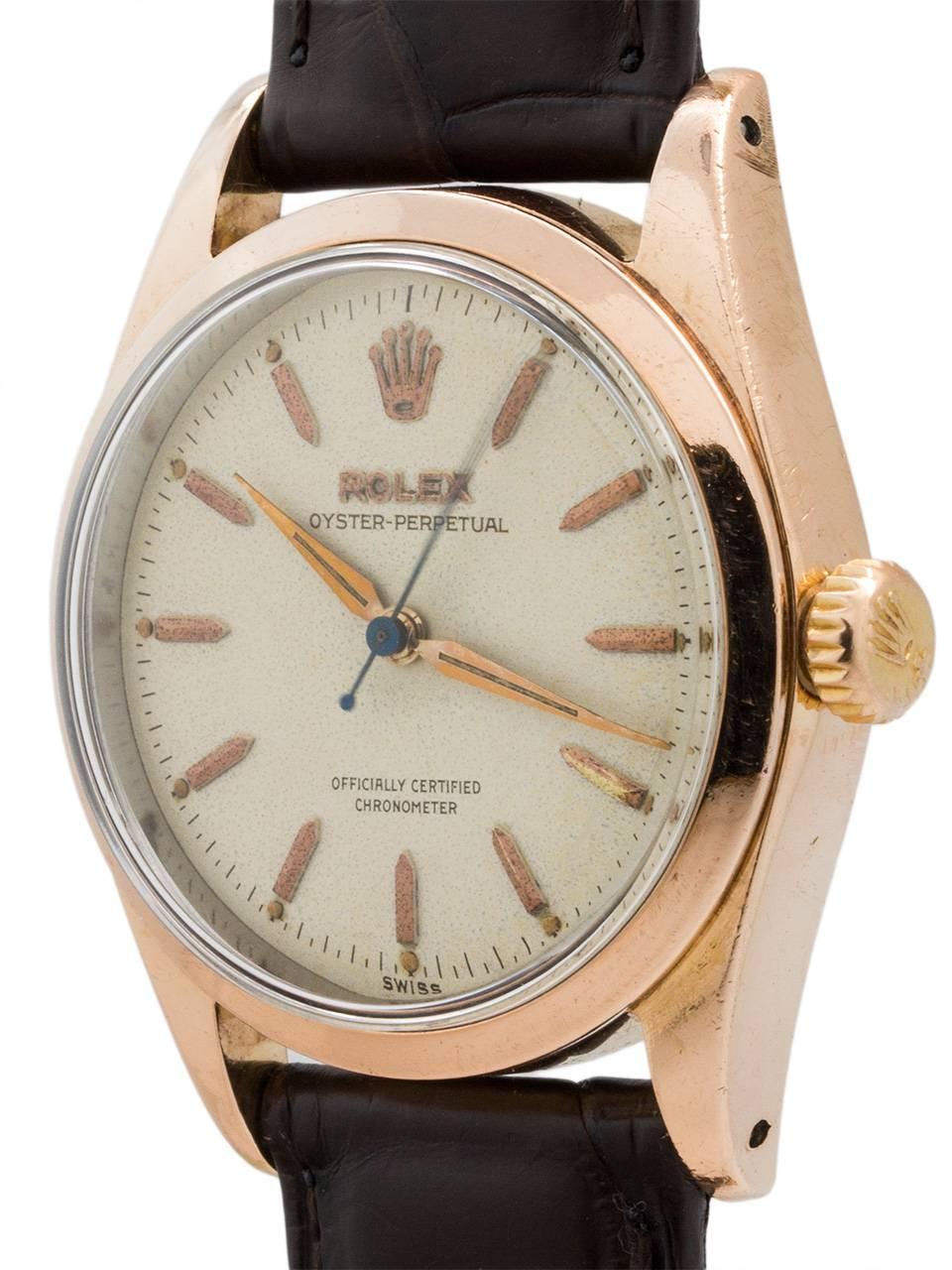 Vintage man’s Rolex ref 6334 Oyster Perpetual rose gold shell, stainless steel case back circa 1954. Featuring 34mm diameter case with smooth bezel, acrylic crystal, and very pleasing original antique white dial with applied rose gold feted baton