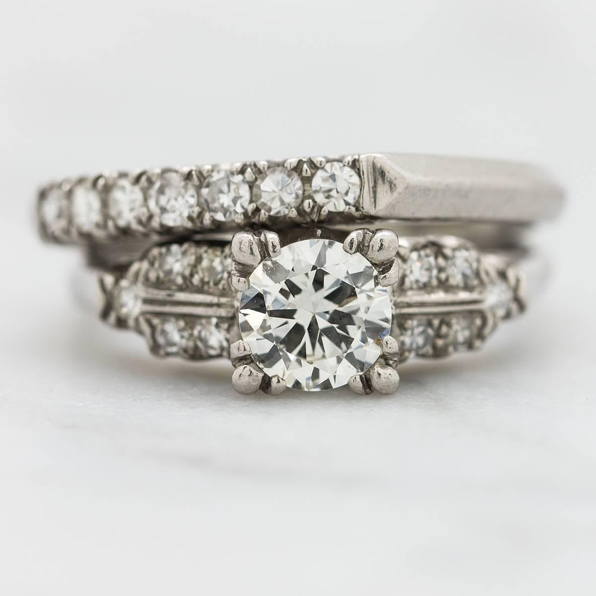 Stunning original antique Retro platinum wedding set starring a brilliantly cut 0.77 carat transitional cut diamond center diamond, G-VS2. Ten round cut bead set side diamonds are the perfect accent to the center stone, set with romantic fish tail