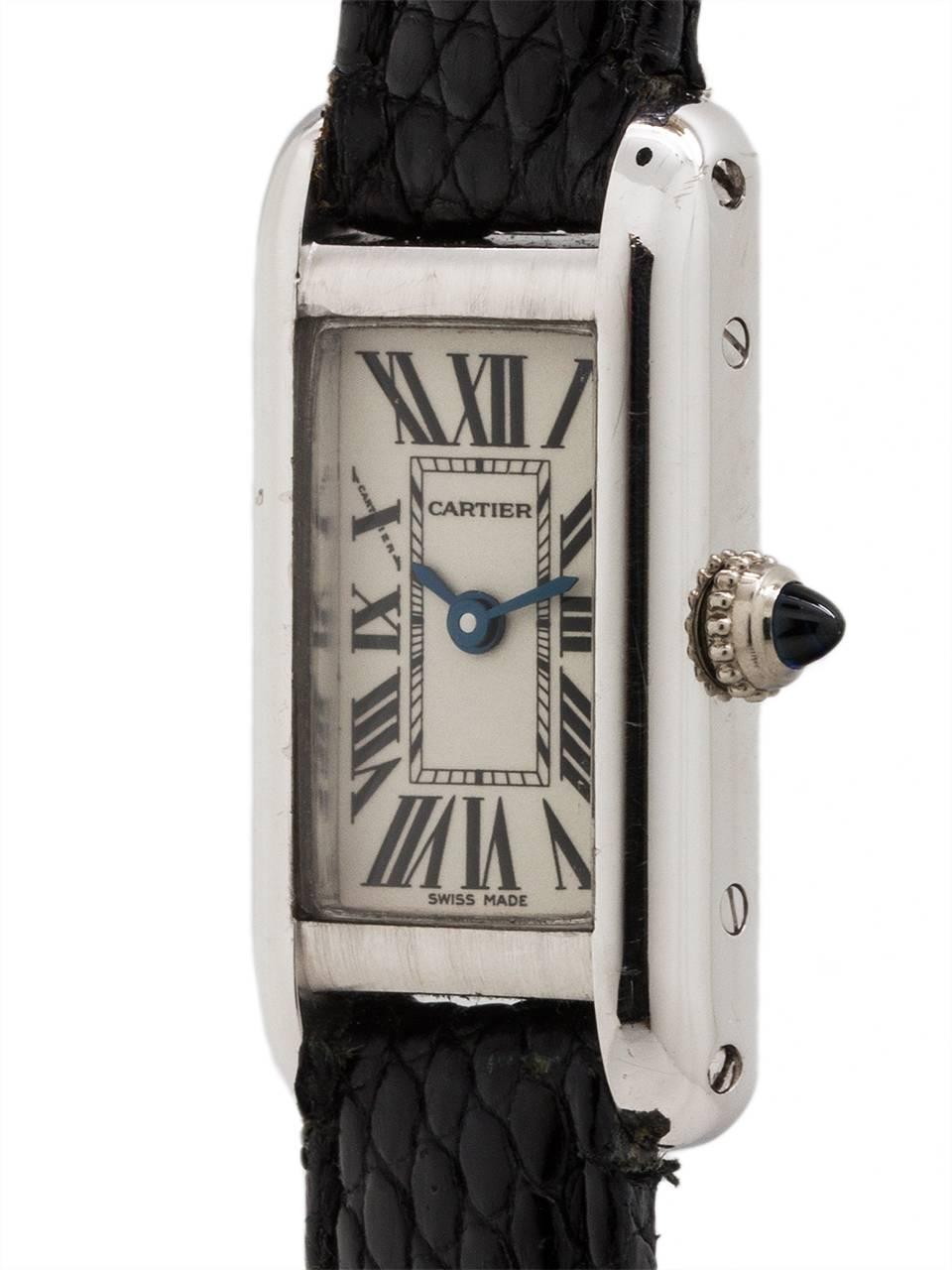 Lady Cartier 18K white gold “Tank Elongee” circa 1980’s with original Cartier 18K WG tang buckle. Featuring a petite 15 X 27mm case secured by 4 side case screws, original gloss white dial with classic Cartier Roman figures, and blued steel hands.